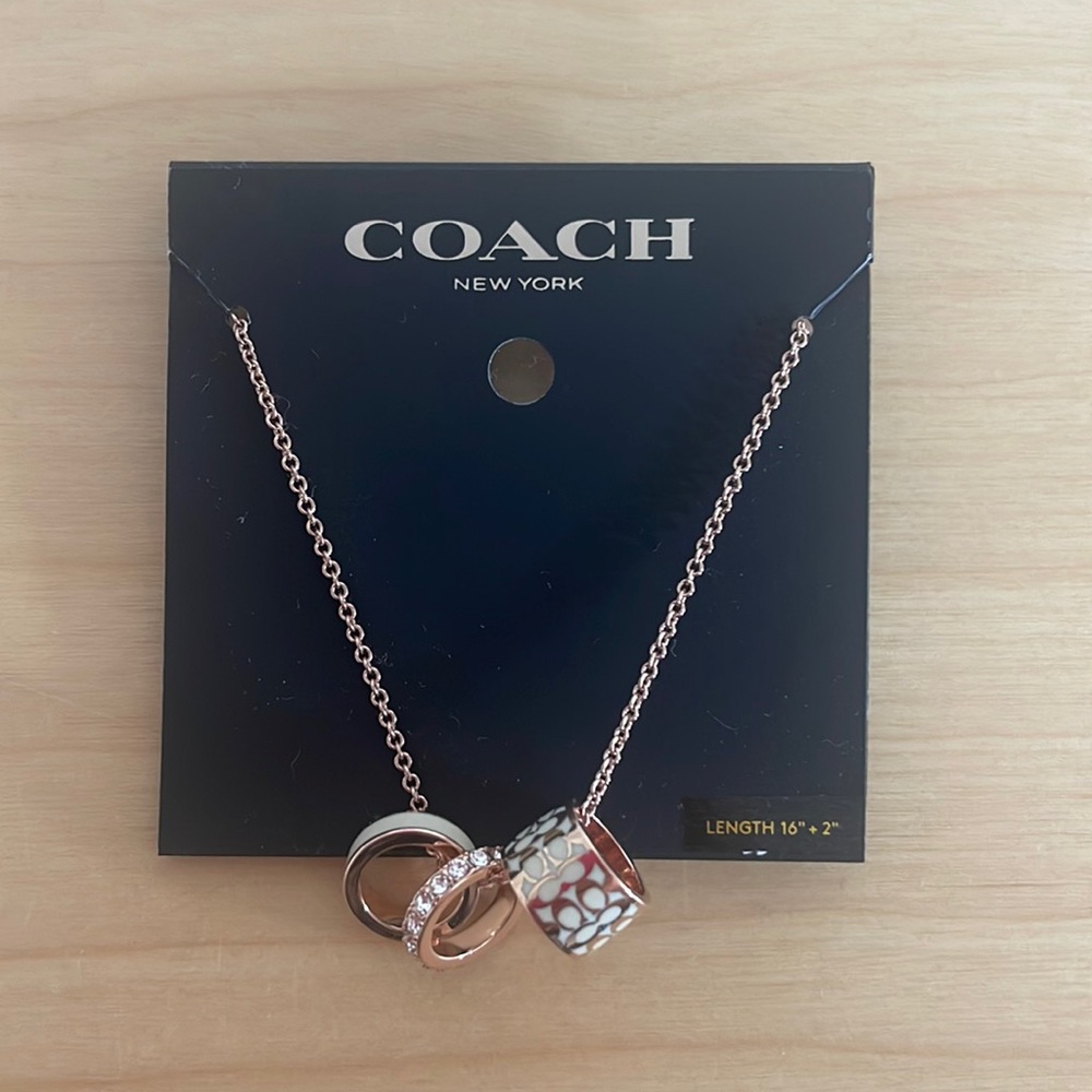 Coach rose gold signature enamel necklace with charms
